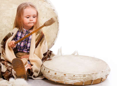 Portrait of little girl posing in studio in chukchi styleの写真素材