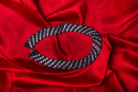 Woman's accessory closeup on redの写真素材