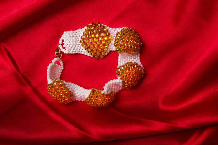 White with gold bead armletの写真素材