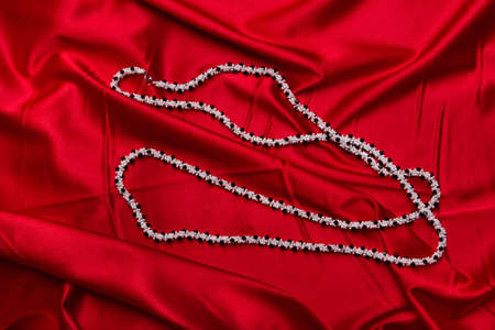 Beautiful jewel isolated on redの写真素材