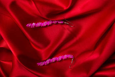 Bead accessory closeup on silkの写真素材
