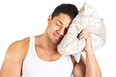 Young man holdign a pillowの写真素材