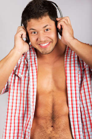 Handsome man listening to some music .over natural backgroundの写真素材