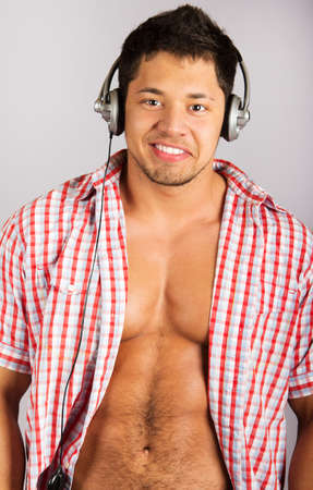 Handsome man listening to some music .over natural backgroundの写真素材