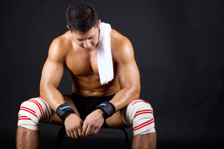 Man in bandage on kneesの写真素材