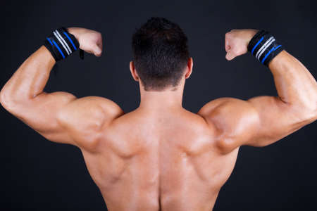 Sexy boy's back on blackの写真素材
