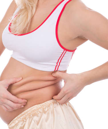 Body part of a fat  pregnant woman の写真素材