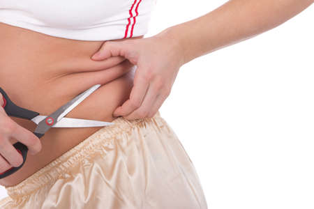 Body part of a fat woman with measuring tape and scissors の写真素材