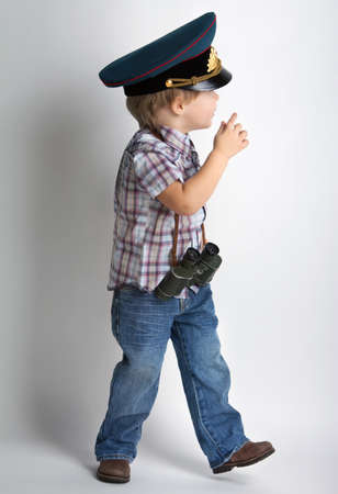 Cute positive boy with binocularsの写真素材