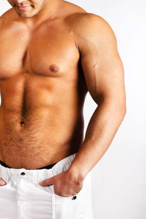 Muscular male body isolated on natural backgroundの写真素材