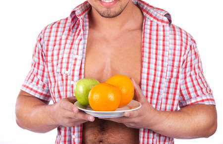 young man with some fresh fruits の写真素材