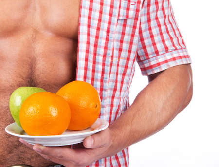 young man with some fresh fruits の写真素材