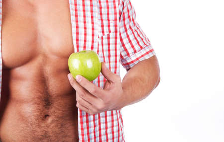 young man with fresh green appleの写真素材