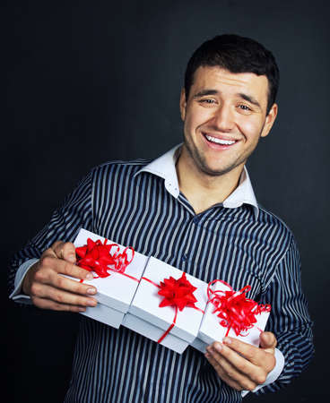 Portrait of happy male with christmass giftsの写真素材