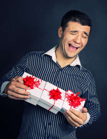 Portrait of happy male with christmass giftsの写真素材