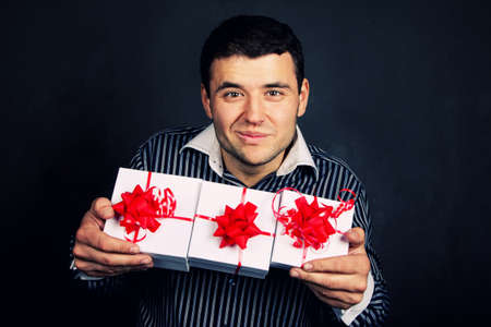 Portrait of happy male with christmass giftsの写真素材