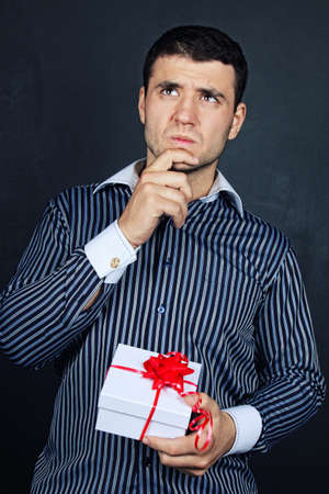 Portrait of male with present gift の写真素材