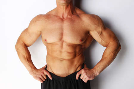 Image of sexy body builders body, isolated on whiteの写真素材