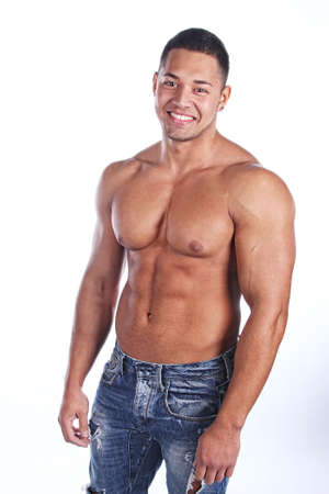 happy muscular young man. Isolated on white background. の写真素材