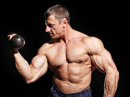 Image of sexy bodybuilder with dumbbellの写真素材