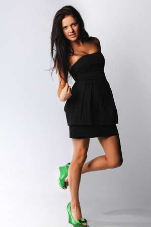Image of sexy brunette female, isolated on greyの写真素材