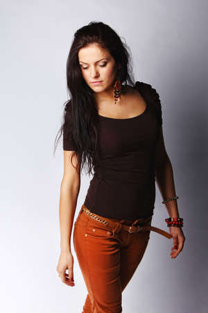 Image of attractive brunette female, isolated on greyの写真素材