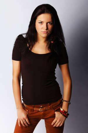 Image of attractive brunette female, isolated on greyの写真素材