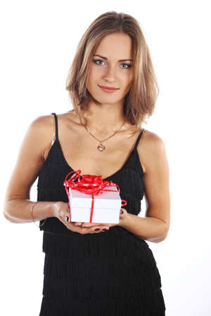 Image of happy brunette female holding christmas gift, isolated on whiteの写真素材