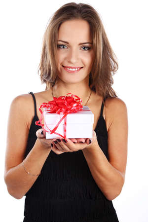 Image of happy brunette female holding christmas gift, isolated on whiteの写真素材