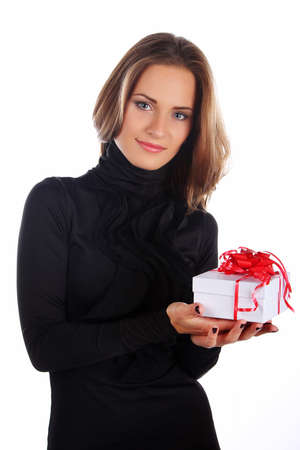 Image of happy brunette female holding christmas gift, isolated on whiteの写真素材