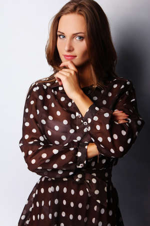 Portrait of sexy brunette girl, isolated on greyの写真素材