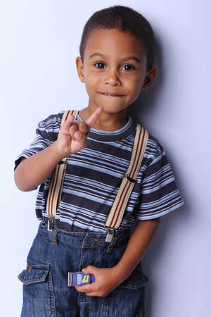 cute african american boy posing  studio shotの写真素材