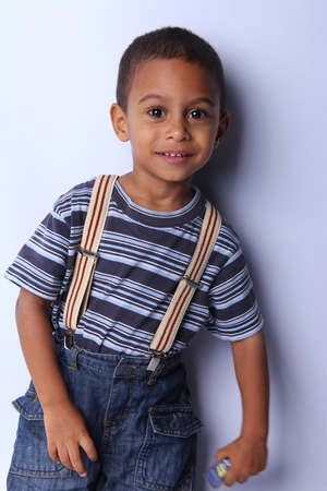 cute african american boy posing  studio shotの写真素材