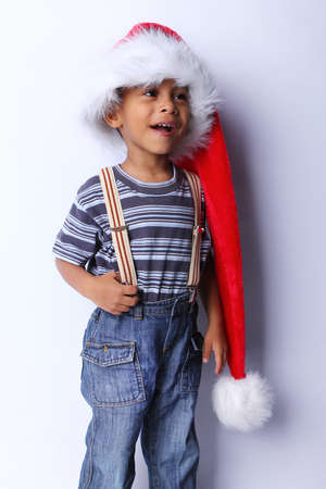 Profile of an adorable African American baby in a Santa Hatの写真素材