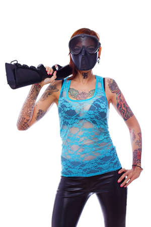 A young punk girl witha shotgun over her shoulderの写真素材