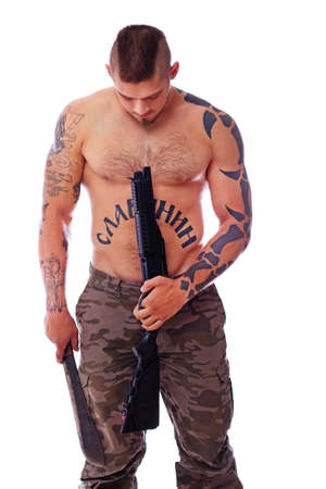   a tattooed man who is armed and dangerousの写真素材