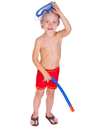 Portrait of young boy posing in studio with mask and tube in sweamwearの写真素材