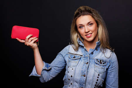 Portrait of sexy woman posing in studio with clutchの写真素材