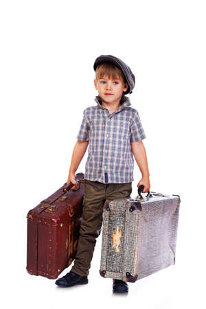 Portrait of handsome kid posing in studio with bagの写真素材