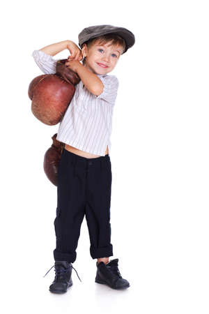 Portrait of handsome kid posing in studio with boxing glovesの写真素材