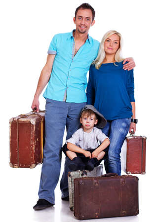 Portrait of lucky family posing in studio with bagsの写真素材