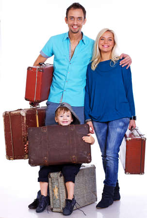 Portrait of lucky family posing in studio with bagsの写真素材
