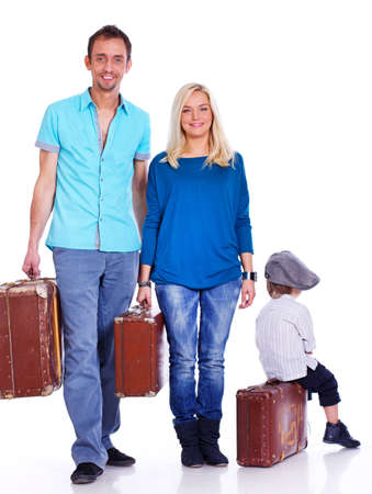 Portrait of lucky family posing in studio with bagsの写真素材