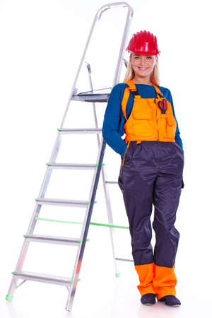 Portrait of sexy woman posing in studio on ladderの写真素材