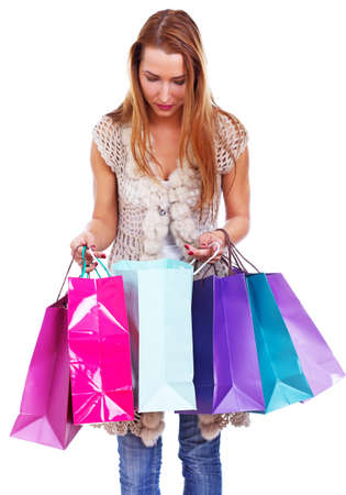 Portrait of young woman doing shopping in cityの写真素材