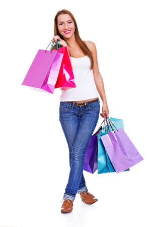 Portrait of young woman doing shopping in cityの写真素材
