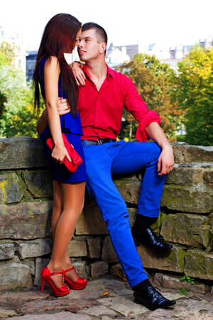 Portrait of couple posing in park in sunny dayの写真素材