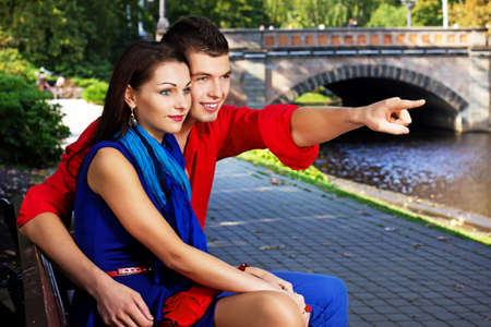 Portrait of couple posing in park in sunny day の写真素材