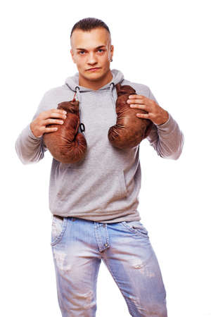 Portrait of sexy man posing in studio with boxing glovesの写真素材