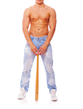 Portrait of sexy shirtless man posing in studio with batの写真素材